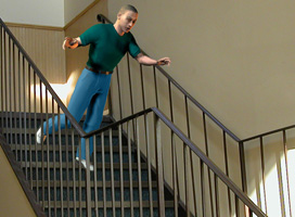 Digitally created image of human model falling down stairs