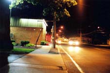 An approaching vehicle at three positions, taken at night